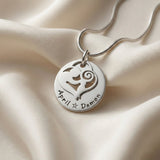 Belle Fever mother’s disc necklace on soft fabric flatlay,  Mother’s Day gift, timeless keepsake

