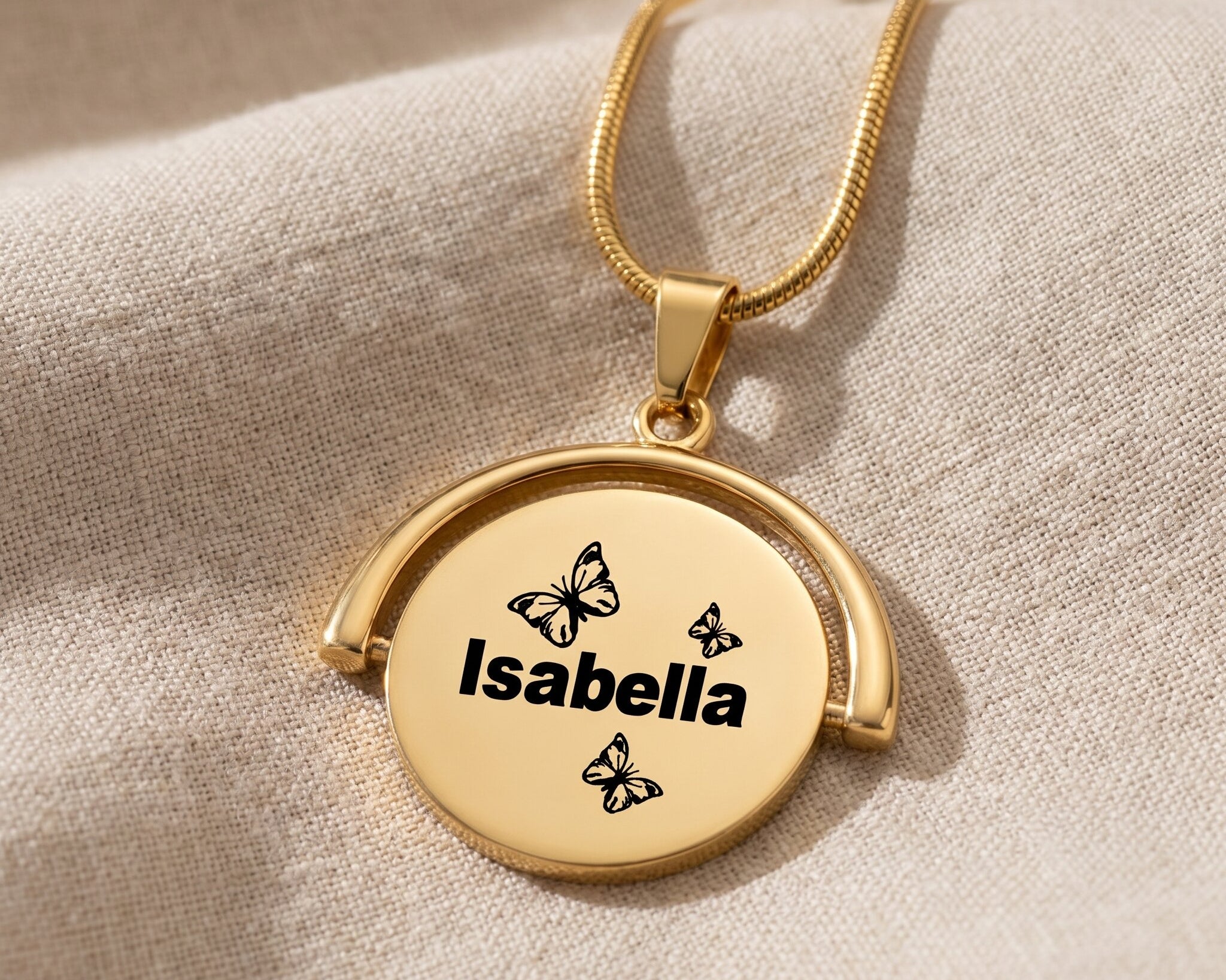 Spinning name necklace in gold with personalised engraving, hidden message keepsake jewellery