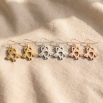 Owl earrings tone comparison showing gold, silver and rose gold finishes, elegant jewellery options