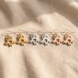 Owl earrings tone comparison showing gold, silver and rose gold finishes, elegant jewellery options