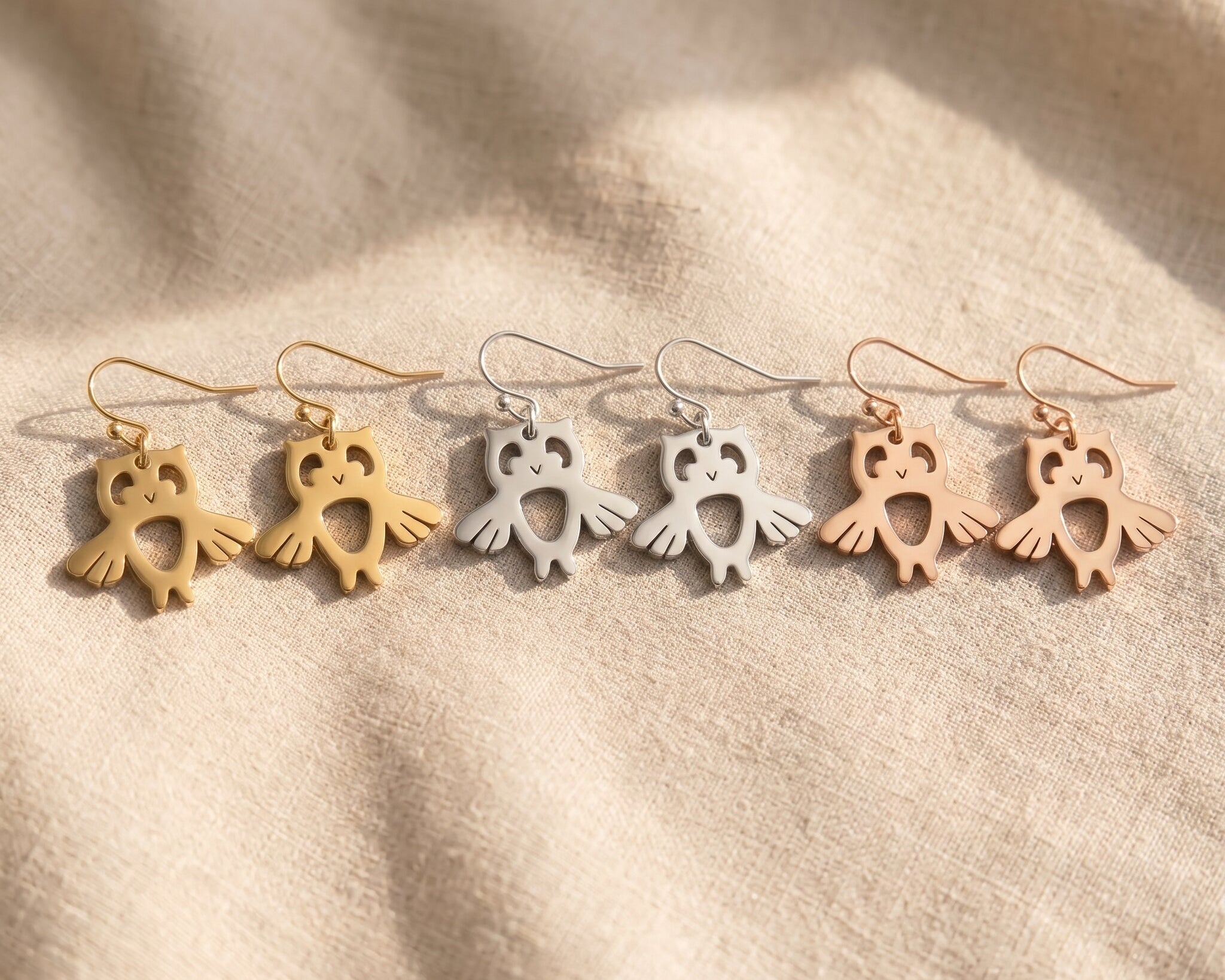 Owl earrings tone comparison showing gold, silver and rose gold finishes, elegant jewellery options