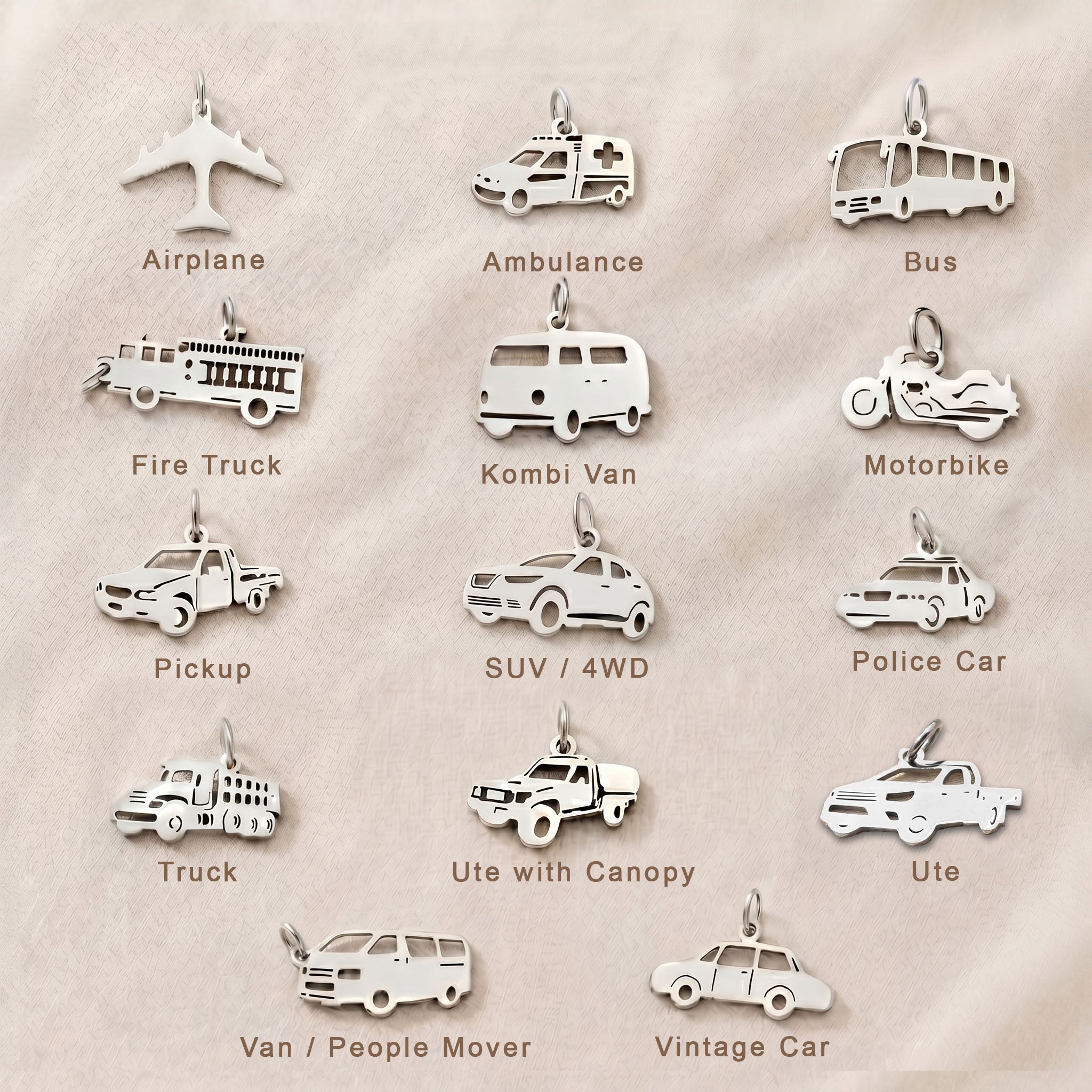 Personalized transport-themed charm collection for keyrings featuring vehicle and adventure-inspired keepsakes