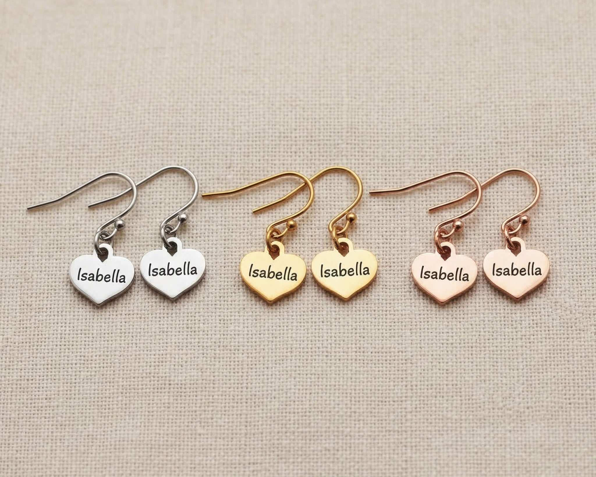 Personalised earrings showing heart shape options with engraved name customization