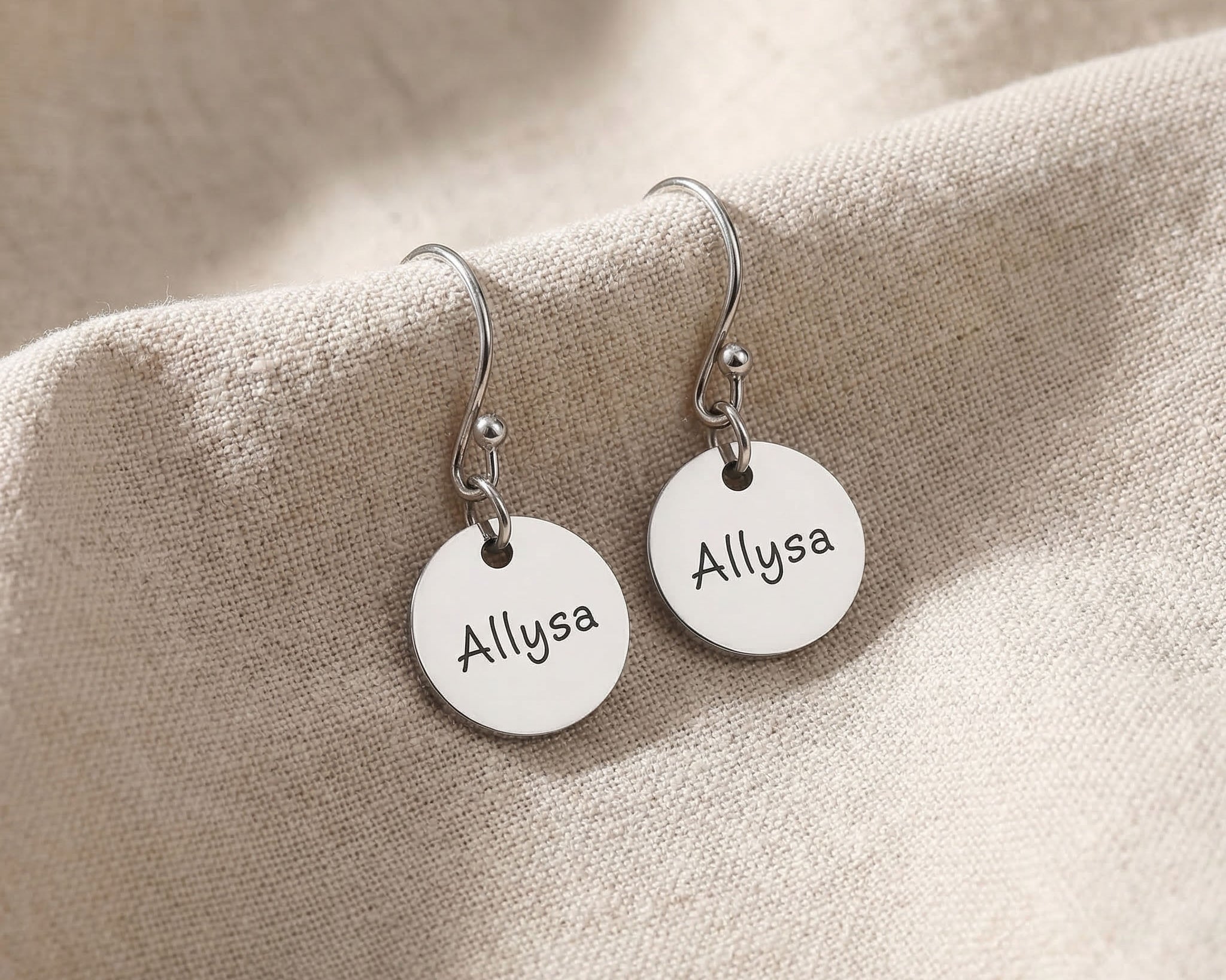 Silver personalised earrings with engraved name on disc design
