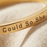 Close-up of personalised inspirational bangle with engraved message detail