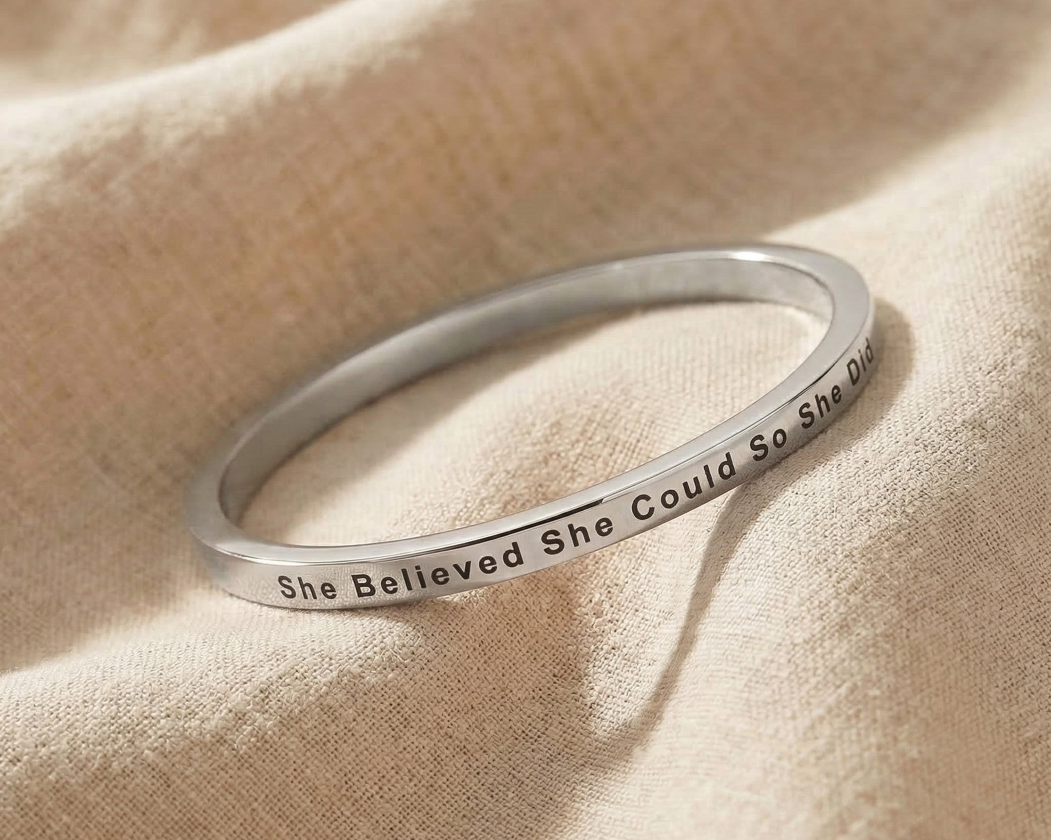 Personalised inspirational bangle in silver with engraved quote, classic minimalist jewellery
