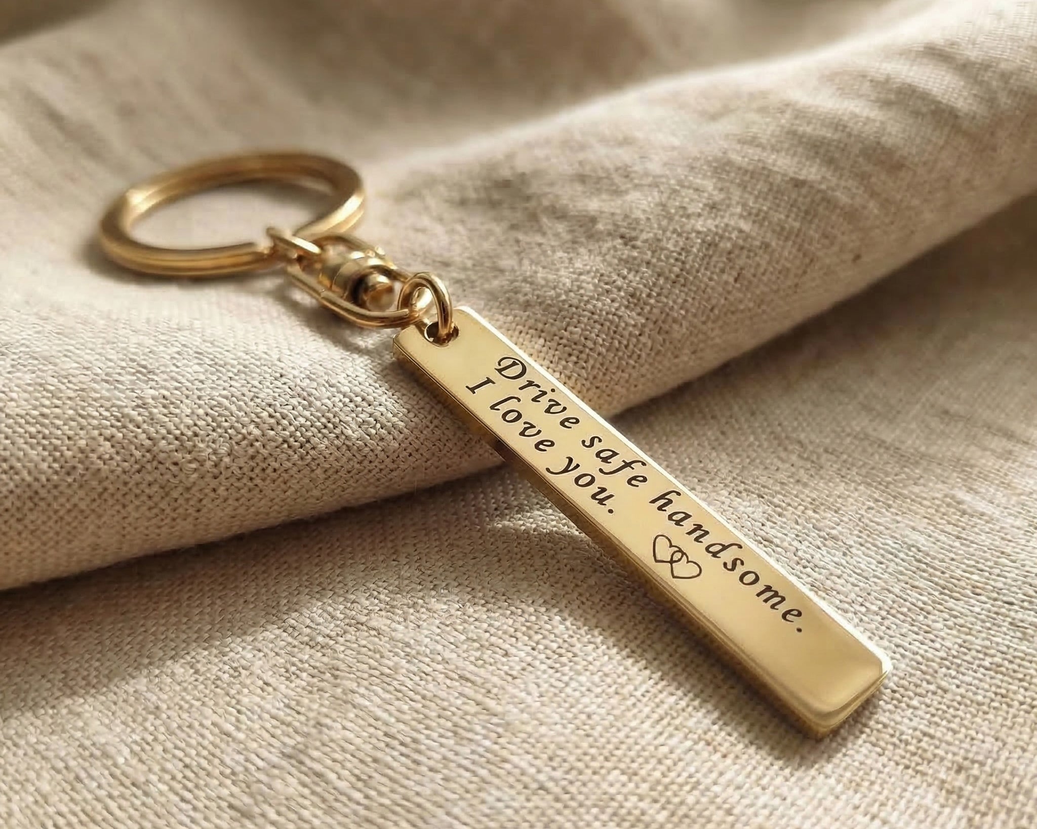 Personalised tag keyring in gold with engraved message, minimal keepsake design