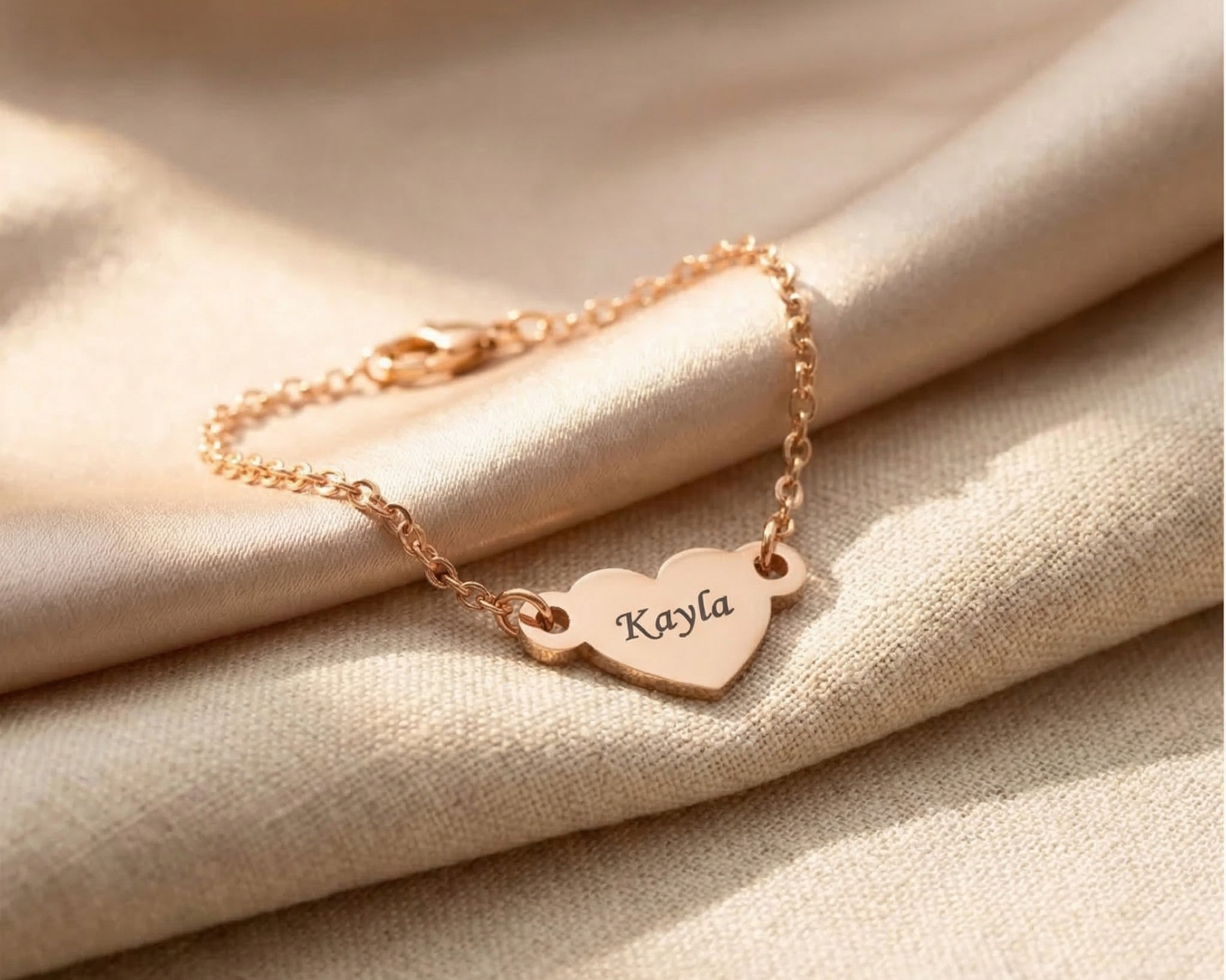 Personalised heart bracelet in rose gold with engraved name, elegant keepsake design