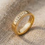 Product video showing personalised band ring with engraved name detail showing fine craftsmanship and finish