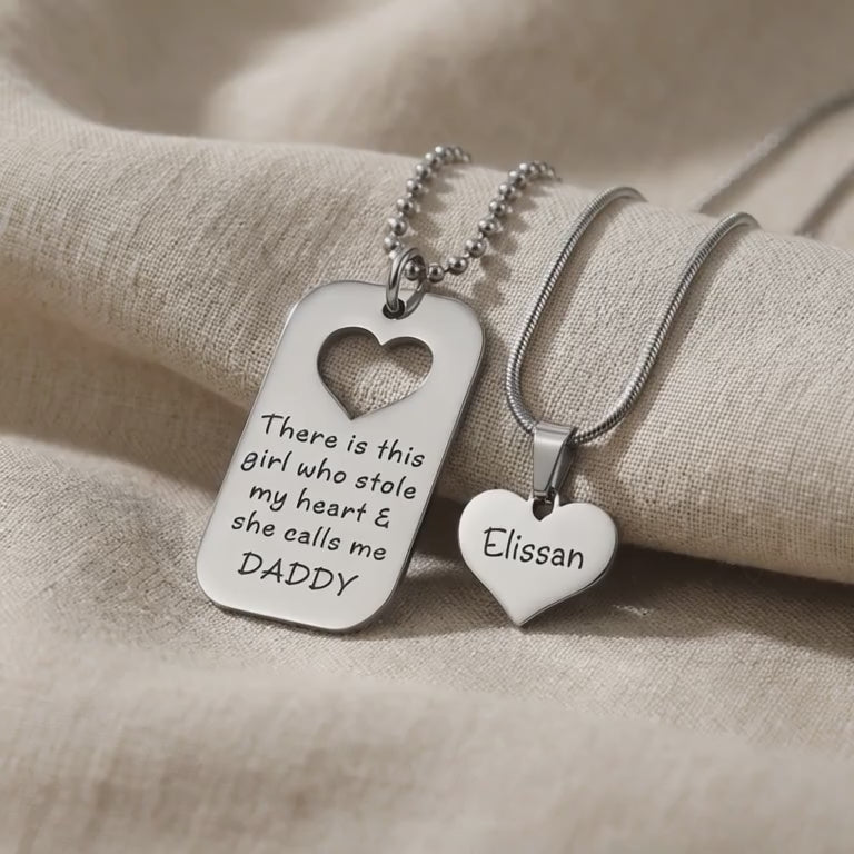Father Daughter Necklace Set showing engraved pendants with heart cut-out detail in close-up view