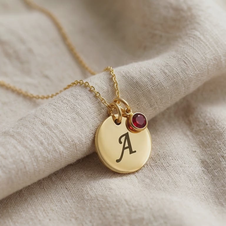 Tokens of Love Necklace with initial charm and birthstone shown in close-up product view