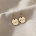 Product video showing personalised earrings with engraved name disc design