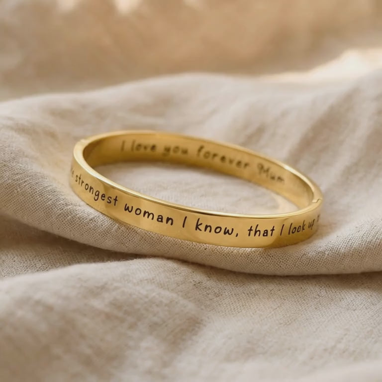 Video showing personalised promise bangle with engraved message and polished finish detail