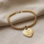 Forever In My Heart Charm Bracelet with engraved heart charm shown in close-up product view