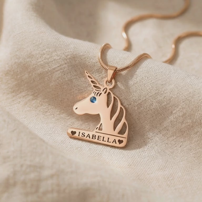 Video showing unicorn head name necklace with engraved name and birthstone detail