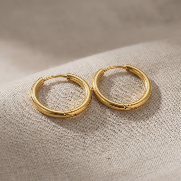 Product video showing chic sleeper hoop earrings with classic round hoop design