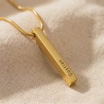 Product video showing vertical bar necklace with engraved bar pendant and customization details