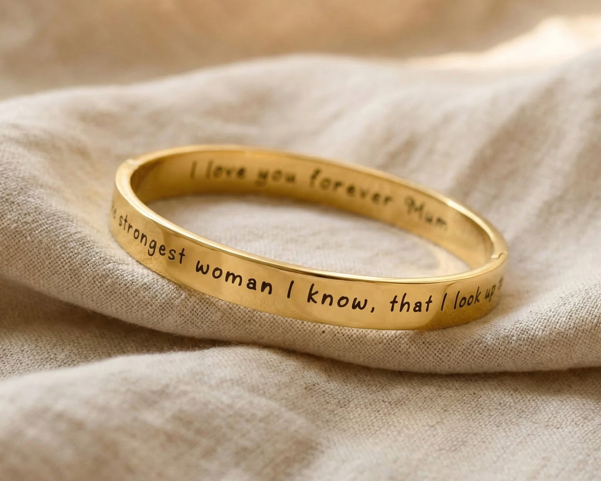 Personalised promise bangle in gold with engraved message, elegant minimal jewellery