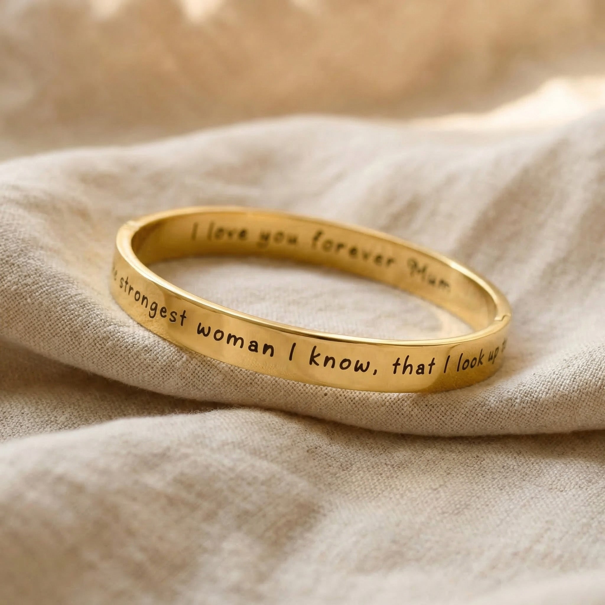 Personalised promise bangle in gold with engraved message, elegant minimal jewellery