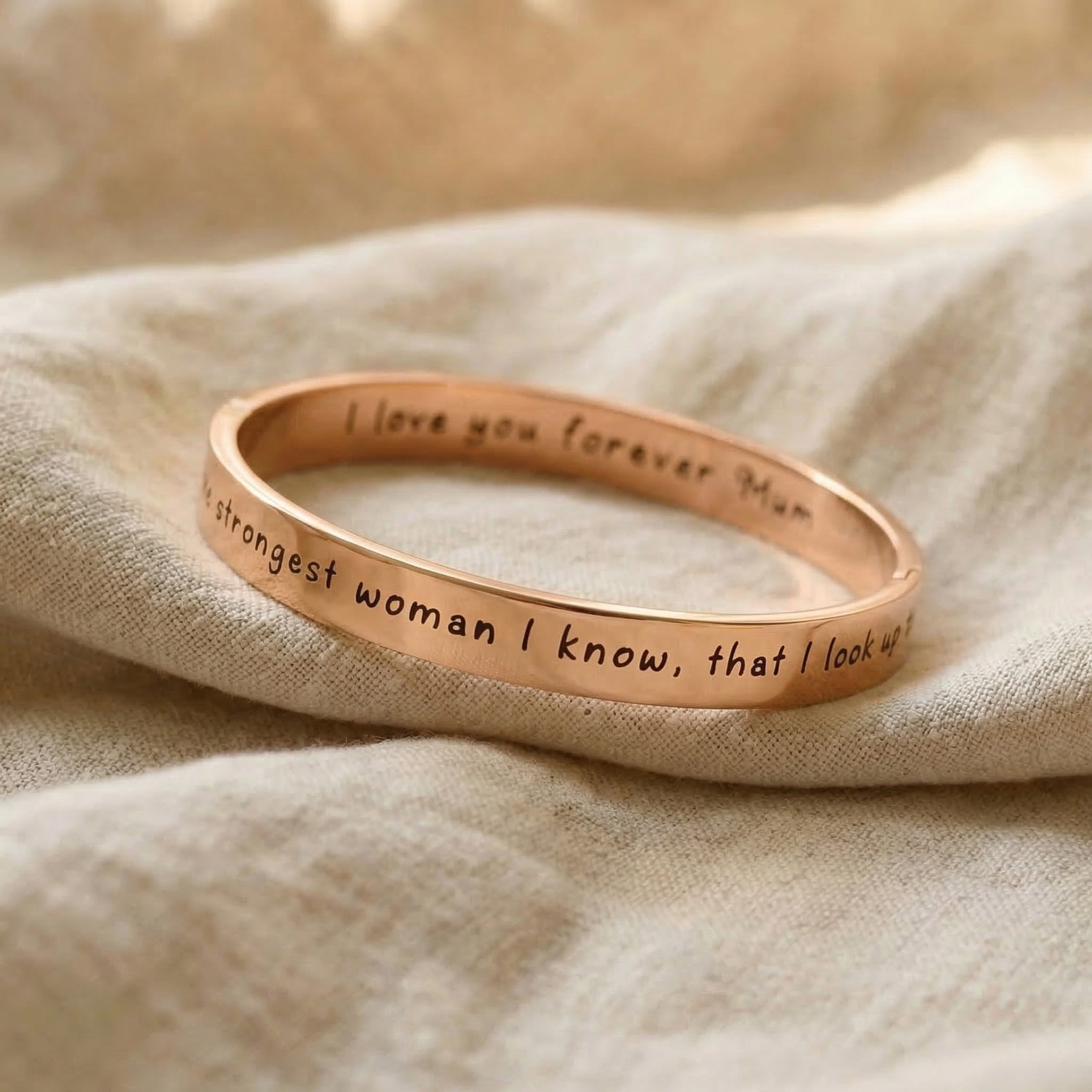 Personalised promise bangle in rose gold with engraved message, refined jewellery design
