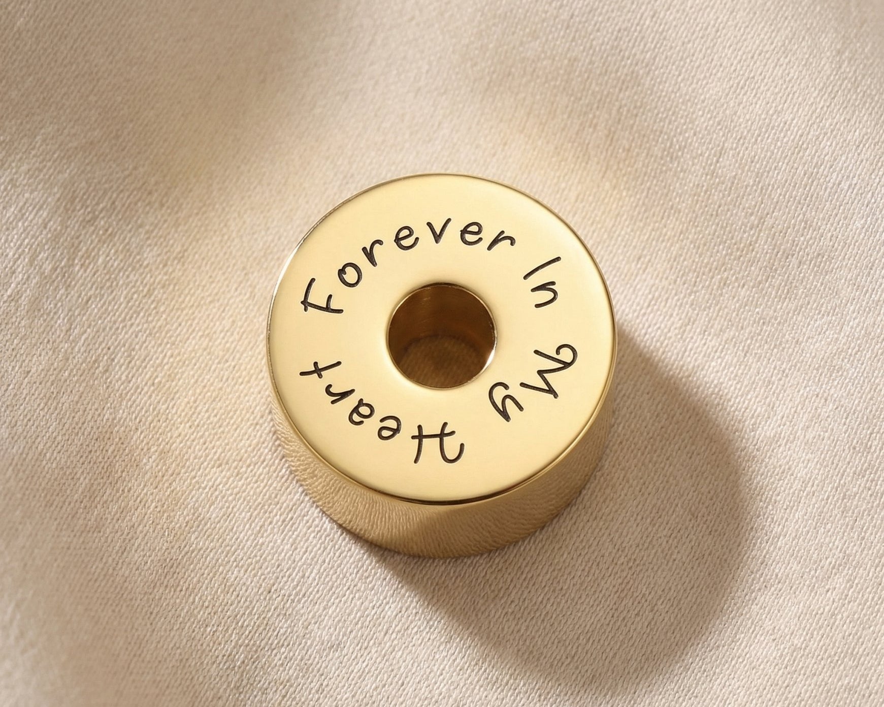 Round cremation charm for Moments Bracelet designed to hold ashes as a sentimental memorial keepsake