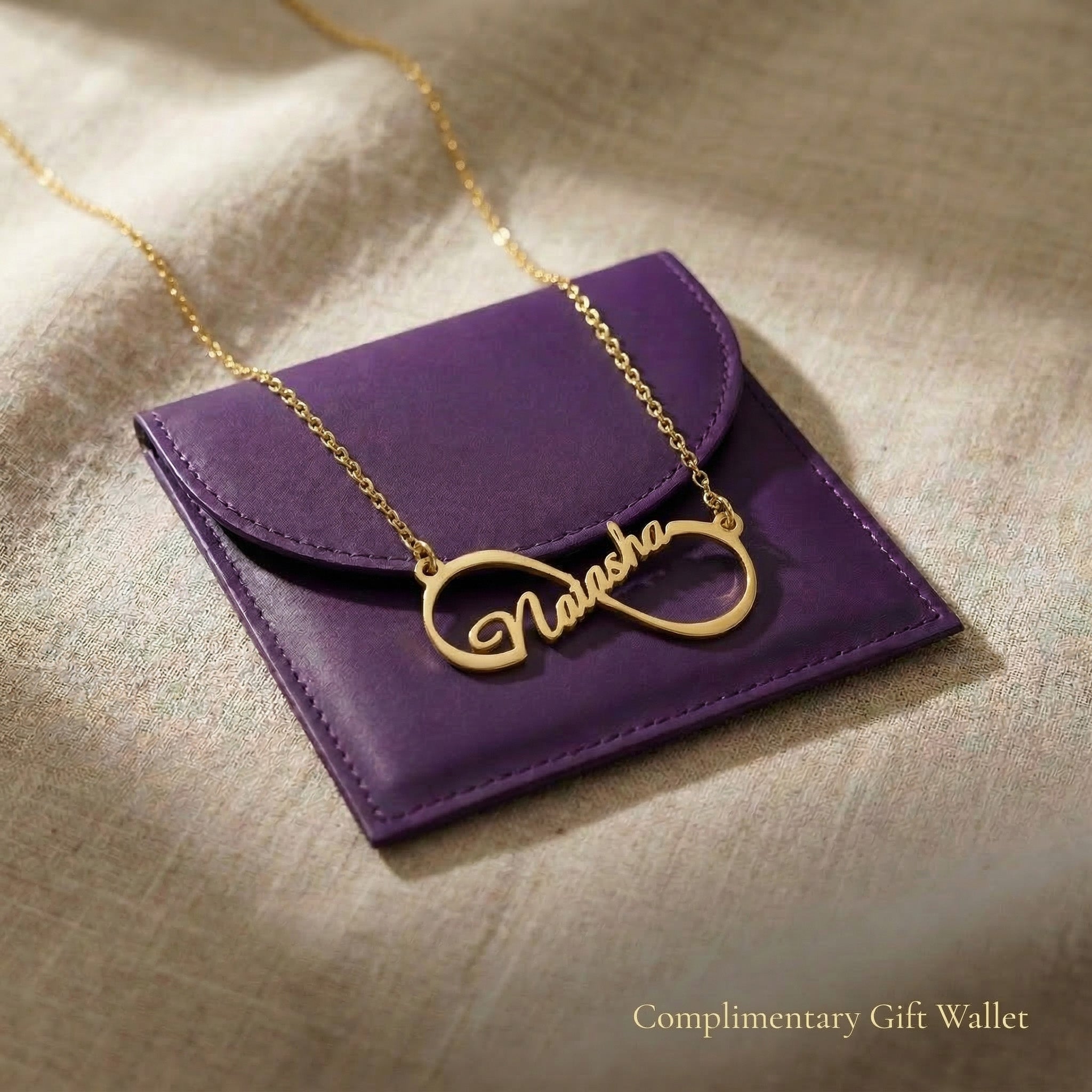 Single infinity name necklace displayed with gift wallet packaging, personalised jewellery gift