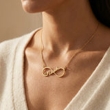 Woman wearing single infinity name necklace with personalised name, everyday jewellery style