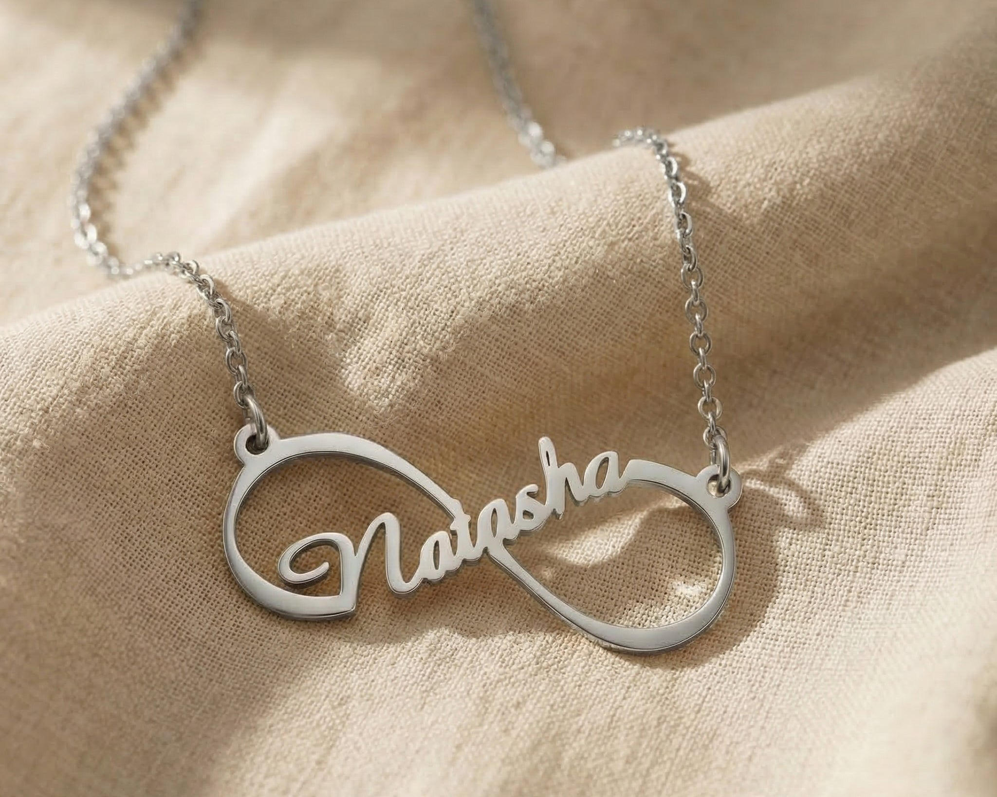 Single infinity name necklace in silver with personalised name, elegant minimal design