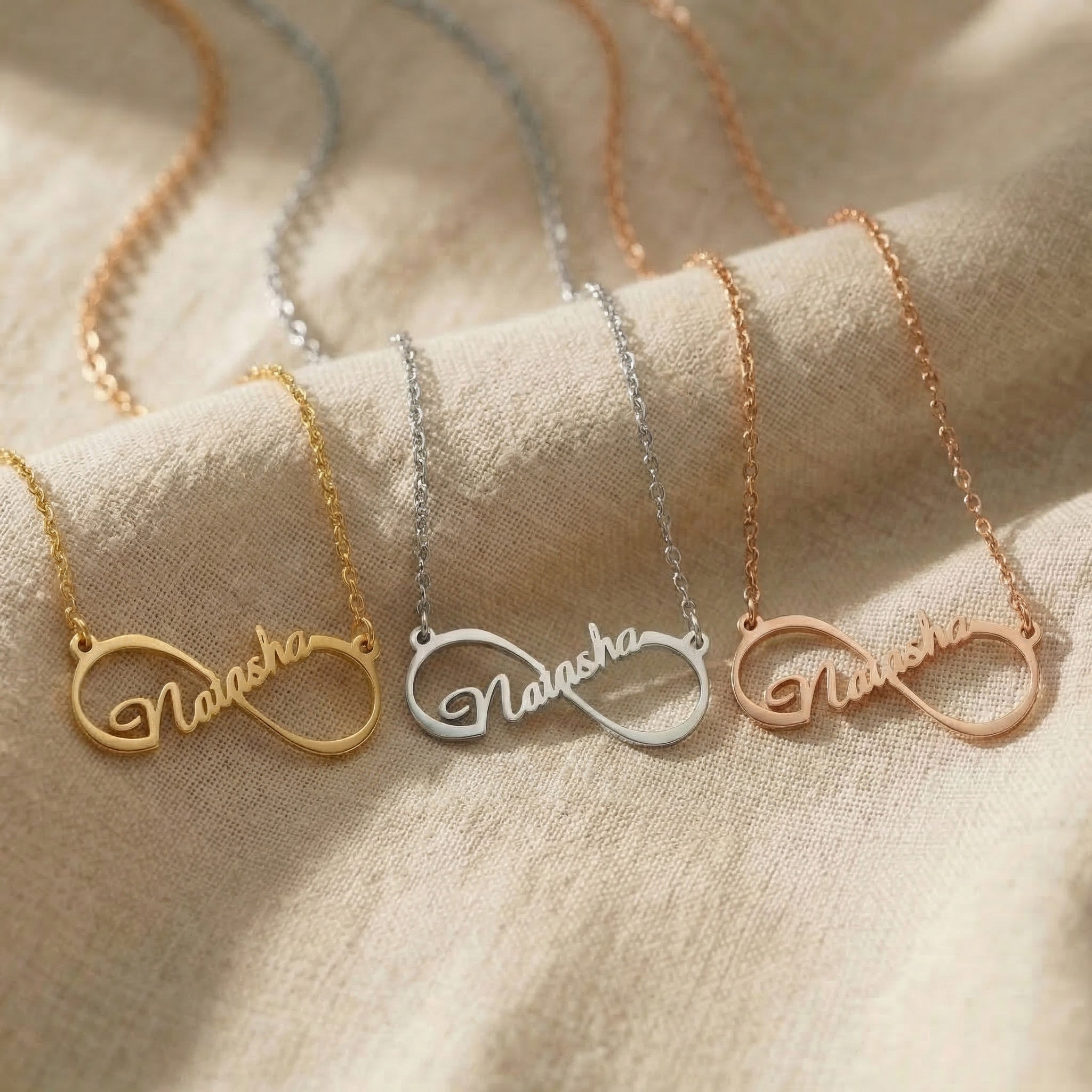 Single infinity name necklace tone comparison showing gold, silver and rose gold finishes