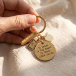 Hand holding teacher life keyring, meaningful thank you teacher gift with engraved keepsake tag