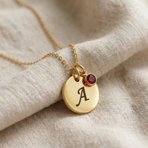 Tokens of Love Necklace in gold with initial charm and birthstone, personalised jewellery piece