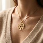 Woman wearing tree of life necklace, meaningful everyday jewellery style