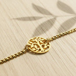 Belle Fever tree bracelet in gold finish with round cutout charm detail. perfect gift for mom 