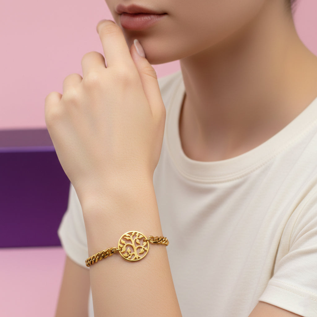 Gold Tree of Life bracelet by Belle Fever styled on wrist, symbol of growth jewelry.