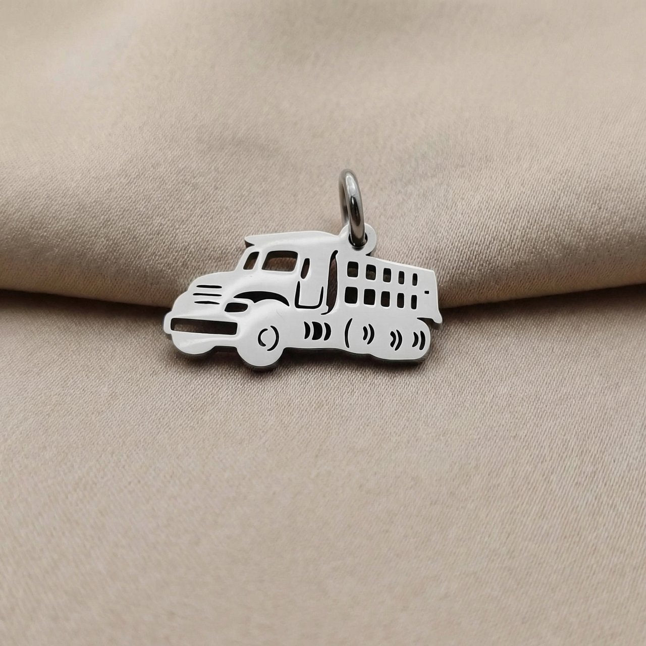 Silver truck charm for keyring symbolizing hard work, travel journeys, and memorable everyday adventures