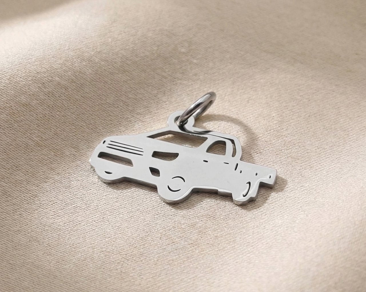 Silver ute vehicle charm for keyring symbolizing work, adventure, and meaningful driving keepsake gifts