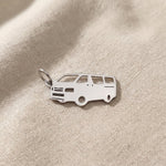 Silver people mover van charm for keyring symbolizing family travel, road trips, and shared life memories