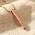 Rose gold vertical bar necklace with engraved bar pendant on delicate chain