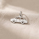 Silver vintage car charm for keyring symbolizing classic car passion, nostalgia, and timeless travel memories